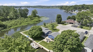 Discover turnkey lake living on Kuhn Lake, part of the - photo 2