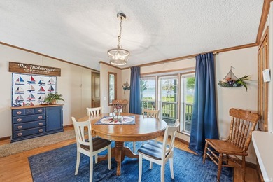Discover turnkey lake living on Kuhn Lake, part of the - photo 9