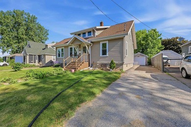 Enjoy lake views from the front yard of this inviting 3-bedroom - photo 1
