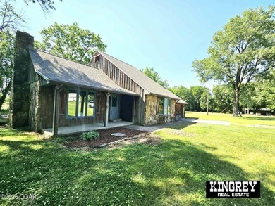 Rustic lodge-style living meets country convenience in this - photo 13
