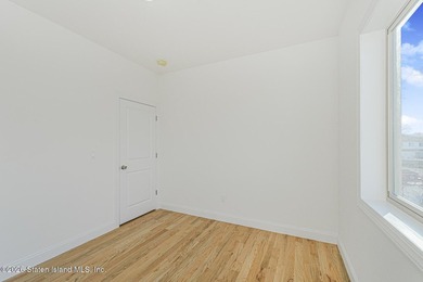 Brand-new 6 over 6 two-family home located in the desirable - photo 14