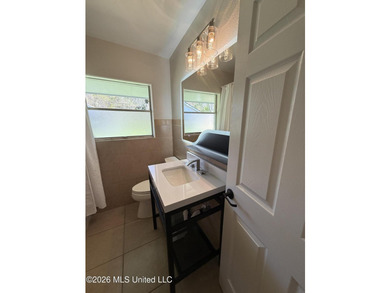 Beautifully remodeled brick ranch just a short walk to the beach - photo 18