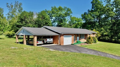 Welcome to The Hideaway! Charming brick ranch offering the - photo 2