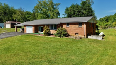 Welcome to The Hideaway! Charming brick ranch offering the - photo 3