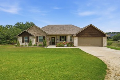 Designed to embrace its waterfront setting, the open-concept - photo 3