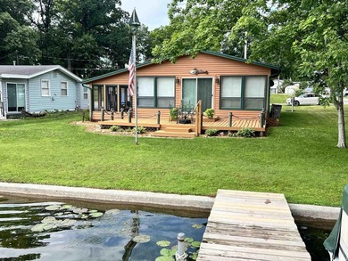 Welcome to lakefront living on beautiful Sechrist Lake! This - photo 1