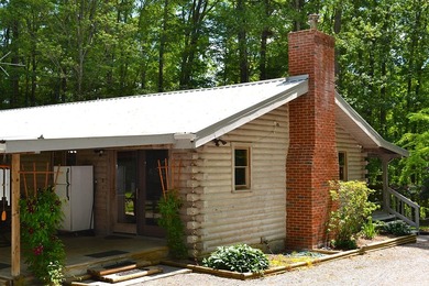Nestled in the woods on a peaceful 3.169-acre lot, this inviting - photo 2
