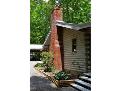 Nestled in the woods on a peaceful 3.169-acre lot, this inviting - photo 3