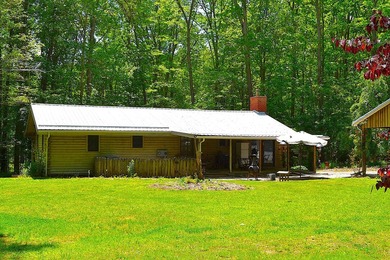 Nestled in the woods on a peaceful 3.169-acre lot, this inviting - photo 4