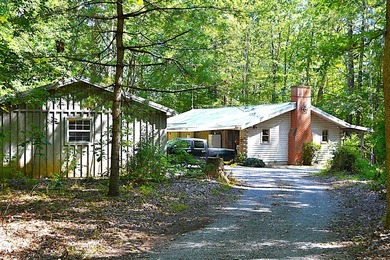 Nestled in the woods on a peaceful 3.169-acre lot, this inviting - photo 10