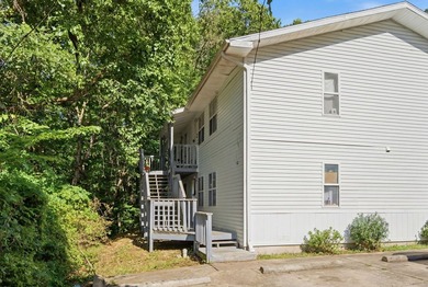 Fully leased 4-plex in the heart of Branson! All four units are - photo 1