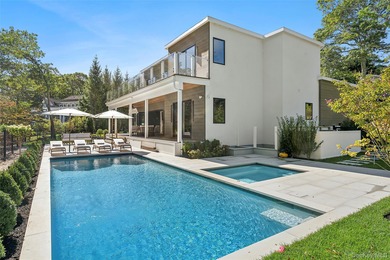 Newly completed and design-driven, this waterfront home makes a - photo 3