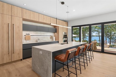 Newly completed and design-driven, this waterfront home makes a - photo 6