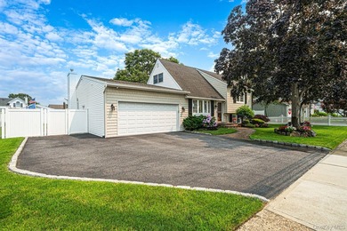 Welcome to this beautifully expanded split-level home situated - photo 1