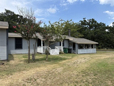 This charming 3-bedroom, 2-bath home with a 4 season sunroom and - photo 2