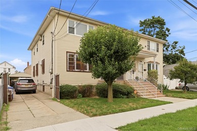 Welcome to this charming semi-attached two-family home offering - photo 2