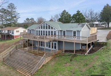 Wake up to open views of the Tennessee River in a home where the - photo 1
