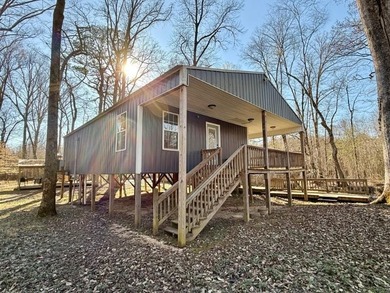 Sitting on a peaceful 24.37 just 1 mile off I22, this 2br/1ba - photo 2