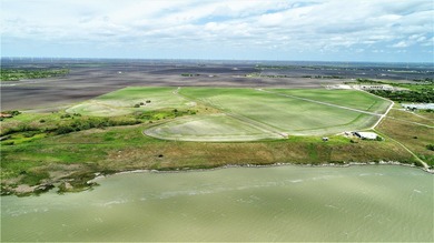 With 2,988.99' +/- of meandering Nueces Bay frontage along the - photo 3