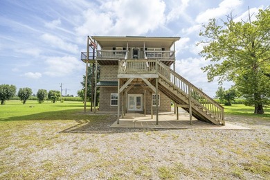 Experience riverfront living with this unique, fully furnished - photo 1