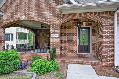 Brick home with a great view of golf course on one side and a