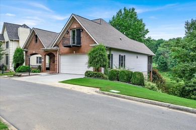 Brick home with a great view of golf course on one side and a