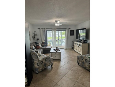 Welcome to this charming two-bedroom, two-bathroom condominium - photo 17