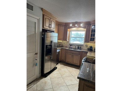Welcome to this charming two-bedroom, two-bathroom condominium - photo 21