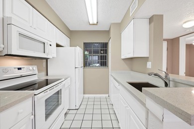 Charming second-floor 2BR/2BA condo in Oakland Forest with - photo 2
