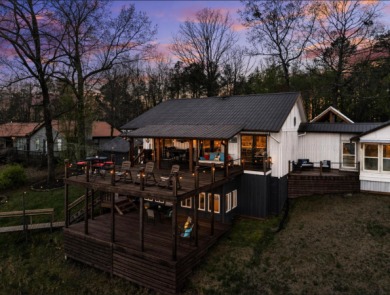 This charming two-story lake home offers stunning views and 1 - photo 4