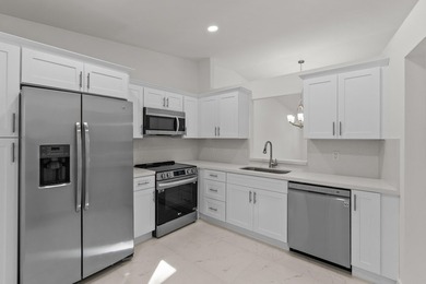 Discover this distinctive 2-bedroom, 2-bath villa that feels - photo 1