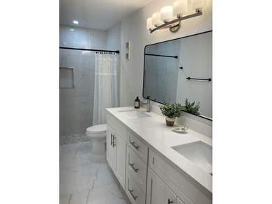 Discover this distinctive 2-bedroom, 2-bath villa that feels - photo 6