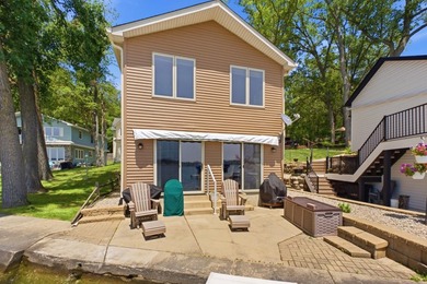 This charming two-story home sits right on the water's edge of - photo 2