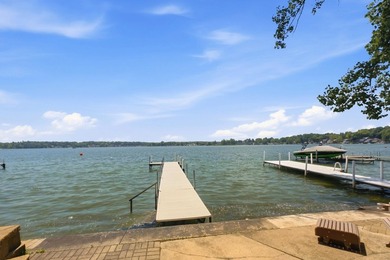 This charming two-story home sits right on the water's edge of - photo 4