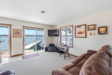 This charming two-story home sits right on the water's edge of - photo 5