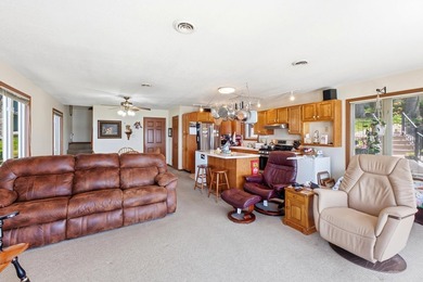 This charming two-story home sits right on the water's edge of - photo 6