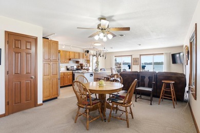This charming two-story home sits right on the water's edge of - photo 8