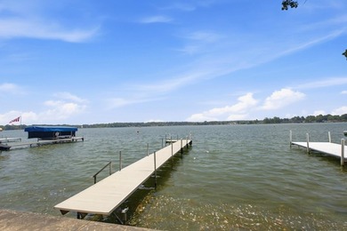 This charming two-story home sits right on the water's edge of - photo 9
