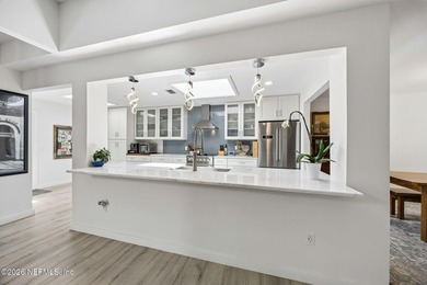Fully renovated and just a 4-minute walk to the beach, this - photo 15