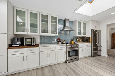 Fully renovated and just a 4-minute walk to the beach, this - photo 18