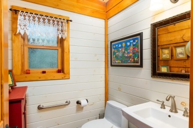 Escape to this beautifully crafted 2BR/2.5BA, 2.5-story cabin