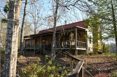 Escape to the lake with this 1BR/1BA cabin on an unrestricted - photo 2