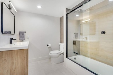 This Boca Lago Villa is completely renovated in every way and