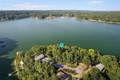 Discover your perfect lakeside retreat on this exceptional 1.28 - photo 1