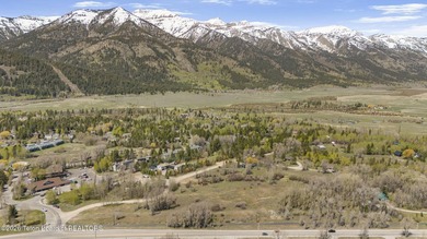 Set on 5 pristine acres in Jackson Hole, WY 83001 this - photo 1