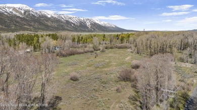 Set on 5 pristine acres in Jackson Hole, WY 83001 this - photo 2