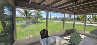 Thoughtfully positioned on a corner lot in SE Cape Coral, this - photo 2
