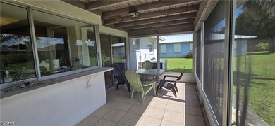 Thoughtfully positioned on a corner lot in SE Cape Coral, this - photo 3