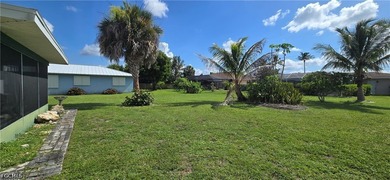 Thoughtfully positioned on a corner lot in SE Cape Coral, this - photo 4