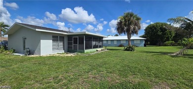 Thoughtfully positioned on a corner lot in SE Cape Coral, this - photo 5